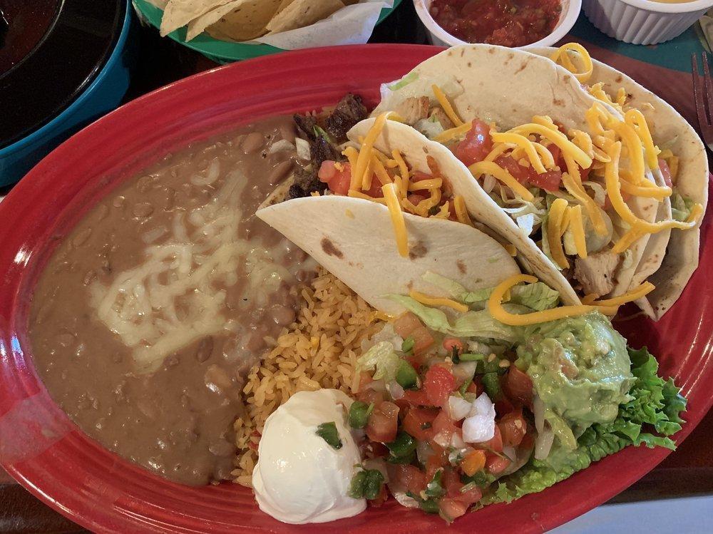 Tacos Supreme · 2 Beef tacos and 1 chicken fajita taco filled with lettuce, tomatoes and grated cheese, guacamole and sour cream. Served with rice and beans.
