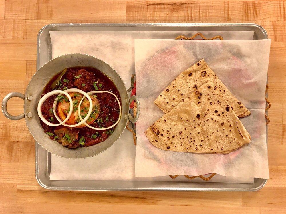 Goat Beets · Shredded root-beets cooked with our dry masala then mixed with chunks of goat meat on the bone after deep marination.