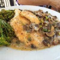 Chicken Piccata · tender seasoned chicken breast sautéed with mushrooms, scallions and capers in a tangy white...