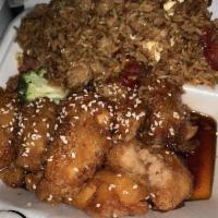Sesame Chicken · Fried dark meat chicken cooked with a tangy brown sauce and sesame seeds.