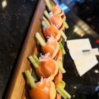 Butterfly Kisses Riceless Roll · Crabmeat, avocado, cucumber wrapped with fresh salmon. Spicy.