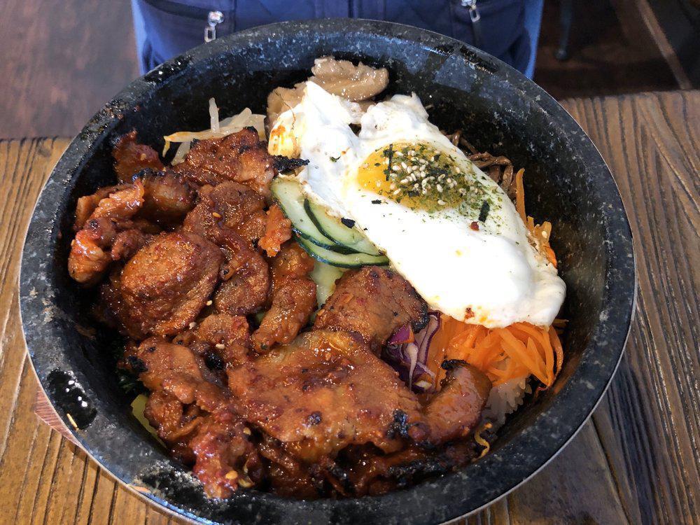 Bibimbop · A bed of rice topped with assorted vegetables, fried egg, and your choice of protein