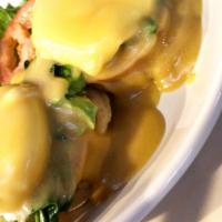Egg Benedict Florentine · Toasted English muffin, sliced tomatoes, sliced avocado, sauteed spinach covered with Hollan...