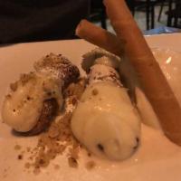 Cannoli · Pastry shell filled with a mix of ricotta cheese, chocolate and pistachio.