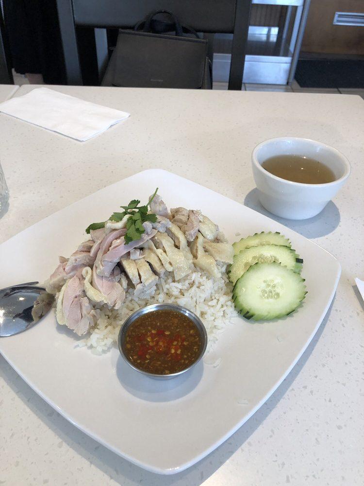 Hainan Chicken Rice · Poached chicken over seasoned rice with a side of garlic ginger sauce and a side of chicken soup. Add extras for an additional charge.