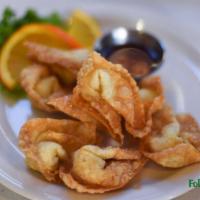 10 Crab Cheese Wontons · Crispy wontons stuffed with crab meat and cream cheese served with sweet and sour sauce.