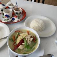 Green Curry · Green curry in coconut milk with bamboo shoots, bell pepper and Thai basil.