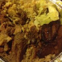 Curry Goat W/ Rice & Peas or White Rice · 