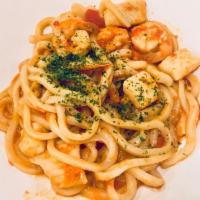Seafood Tomato Cream Udon · Shrimp, fish, squid and mussels cooked in a garlicky tomato cream sauce. Flavor has a slight...