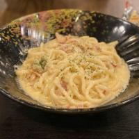 Carbonara Udon · Italian cream sauce with a twist. Tender pork marinated and rubbed with Miso, then sauteed i...
