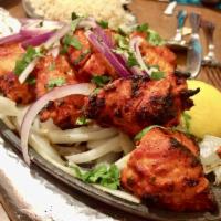 Chicken Tikka · Boneless juicy pieces of chicken marinated in aromatic Indian herbs and cooked in the clay o...