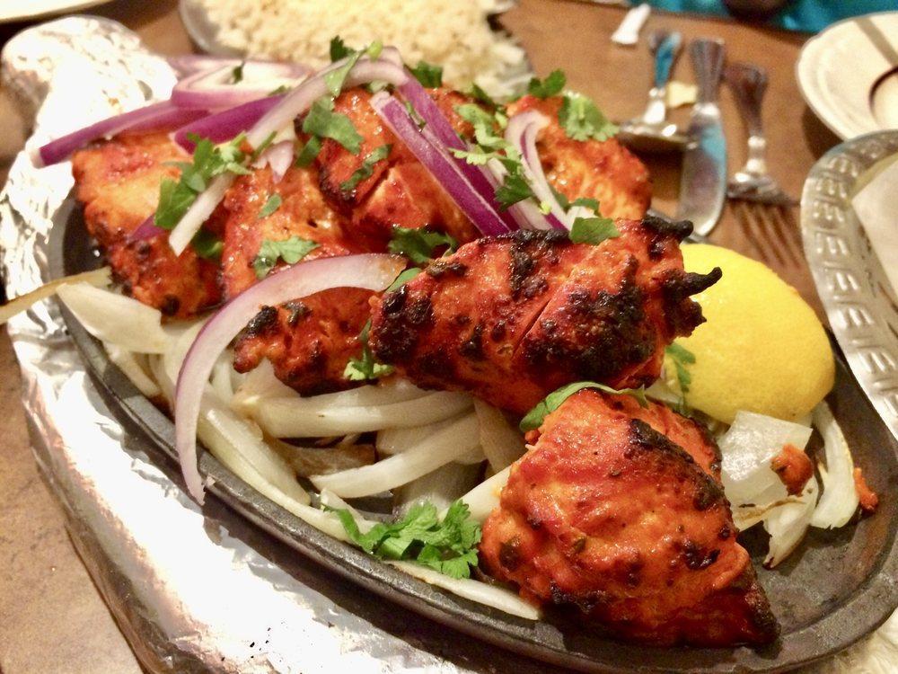 Chicken Tikka · Boneless juicy pieces of chicken marinated in aromatic Indian herbs and cooked in the clay oven. Specialties from the charcoal clay oven.