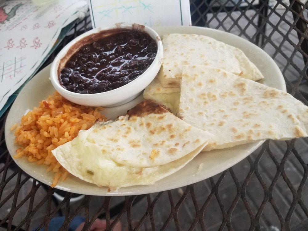Quesadillas · A large grilled flour tortilla filled with Jack cheese, mild pico de gallo and seasoned ground beef or shredded chicken. Served with sour cream and guacamole.