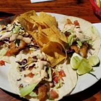 Beer Battered Fish Tacos · Beer battered cod, cabbage, our white sauce and pico. On soft white corn tortillas.