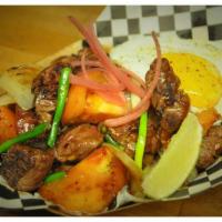 Shaken Beef · Cubed filet mignon, tossed in the wok with onions, tomatoes, and our blend of spice and sauc...