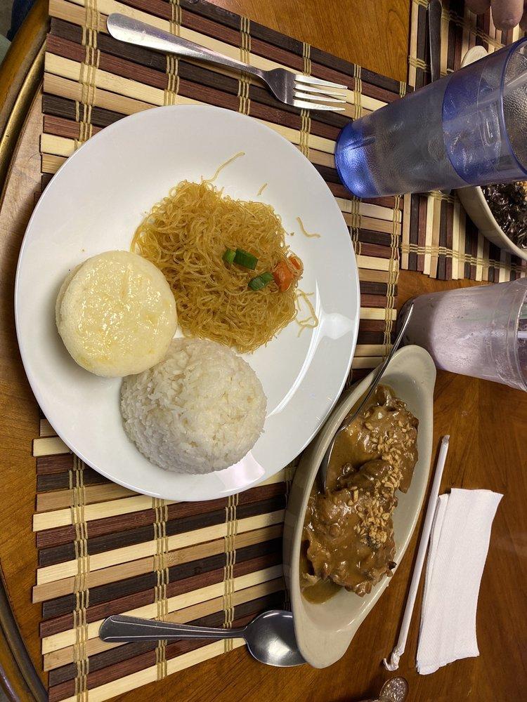 Chicken Adobo · Boned-in chicken marinated with vinegar, garlic and soy sauce with rice.