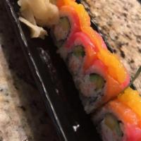 Cherry Blossom Roll · Crabmeat, cucumber, and mango, topped with tuna and fresh salmon with mango sauce.