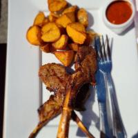 Rack of Lamb · Marinated and grilled. Served with mashed potatoes.