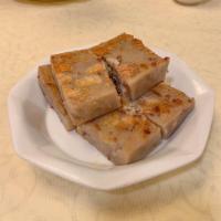 Pan Fried Taro Cake · Our taro cake is made with bits of dried shrimp, chinese bacon, and flour. 3 slices