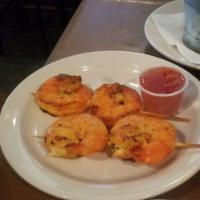 Grilled Shrimp Skewers · Comes with a side of chili lime sauce.
4 large Shrimp