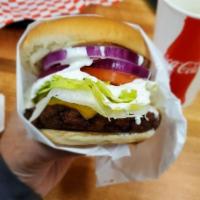 Falafel Burger · Lettuce, tomato, onions, cheese and white sauce.