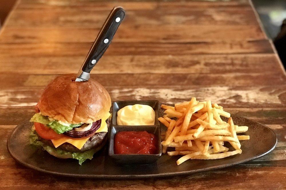 Classic Beef and Lamb Burger · Our 8 oz. signature blend with American cheese, lettuce, dill-relish mayo, tomato, caramelized onion served with french fries.
