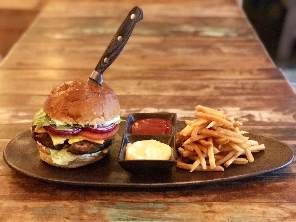 Veggie Burger · Our freshly made veggie blend with black beans, mozzarella cheese, lettuce, tomato, relish mayo, caramelized onion served with french fries.