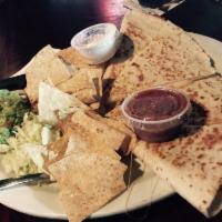Quesadilla · Chicken, ground beef, pulled pork or veggie. Served with tortilla chips, lettuce, tomatoes, ...