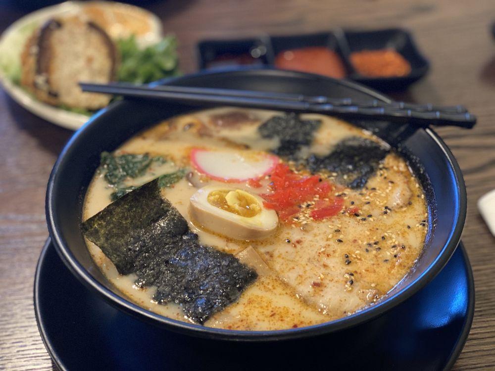 Tonkotsu Ramen · Ramen in a pork-based broth, topped with slices of roasted pork, bean sprout, spinach, shiitake mushroom, fish cake, nori and a soft boiled egg.