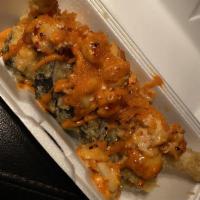 Earthquake Roll · Deep-fried: shrimp tempura, cream cheese, cucumber, avocado, baked imitation crab with bay s...