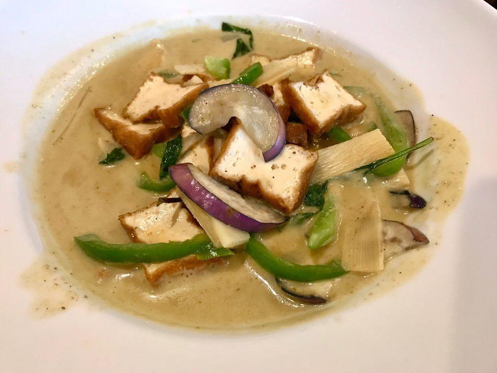 Green Curry · Sweet and spicy green curry paste, coconut milk, egg plant, bell pepper, bamboo shoot, lime leaves and basil. Gluten-free, hot and spicy.
