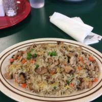 Chicken Fried Rice · Prepared steamed white rice with soy sauce, eggs, peas, carrots and green onions with chicken.