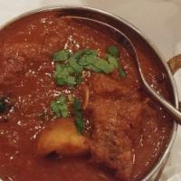 Chicken Vindaloo · Tender cubes of chicken and potato stewed together in goan style red hot curry.