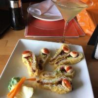 Peacock Roll · Tempura fried spicy tuna with soy paper and avocado. Topped with spicy eel sauce. Hot and sp...