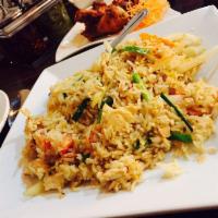 Thai Fried Rice · Fried rice cooked with tomato, onions, egg and carrot.