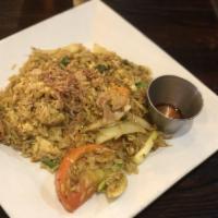 Curry Fried Rice · Traditional Thai fried rice stir-fried with egg, tomato, carrot, onions and yellow curry pow...