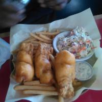 Fish and Chips · Tender battered Alaskan whitefish cooked till golden brown. Served with fries and coleslaw. ...