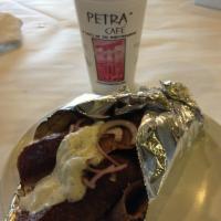 Classic Gyro Sandwich · A mixed of beef and lamb, grilled on a autodoner, sliced, rolled in a warm pita bread, with ...