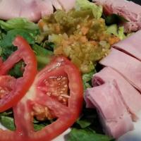 Muffaletta Salad · Ham, salami, provolone cheese, with lettuce, tomatoes, giardiniera, and house dressing.