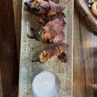 Bacon Wrapped Jalapenos · Stuffed with our savory cheese blend, wrapped in applewood smoked bacon.