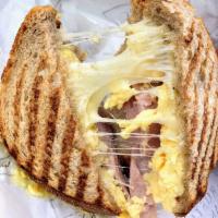 Breakfast Panini · Our focaccia bread grilled with scrambled organic farm eggs with ham, Gruyere, and provolone...