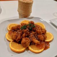 Orange Chicken · Chopped, battered and fried chicken pieces coated in a sweet orange-flavored sauce and toppe...