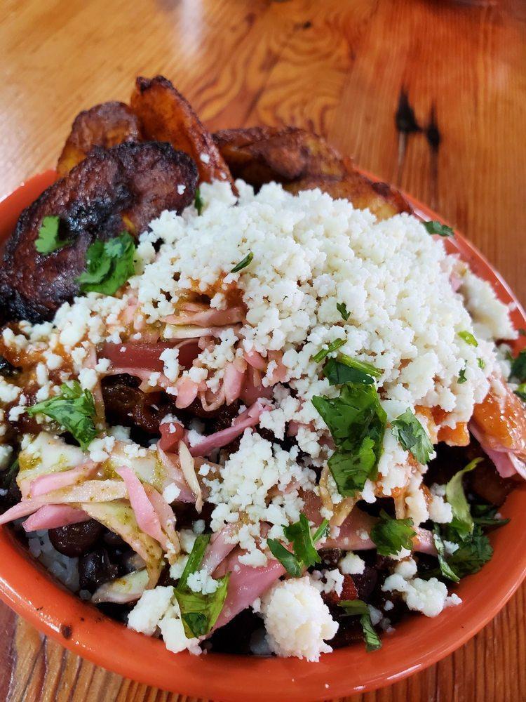 El Diablo Arepa · Pork belly topped with pickled onions, cilantro lime verde sauce, queso fresco and cilantro.