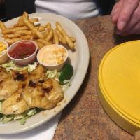 Fish Tacos · 3 grilled alaskan cod tacos with fresh cabbage, salsa and creamy chipotle sauce. Served with...