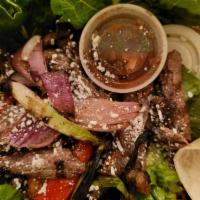 Fajita Salad · Flame grilled meats and vegetables (red bell and jalapeno peppers, red and green onions, tom...