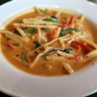 Red Curry · Red curry in coconut milk cooked with bamboo shoots, bell peppers and kaffir lime leaves and...