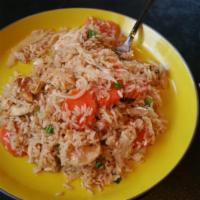 Thai Fried Rice · Stir fried rice with egg, tomatoes, carrot and yellow and green onions.