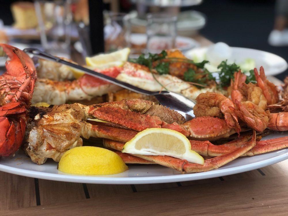 The Crab and Lobster Feast For 2 People · A whole Maine lobster with king crab legs, snow crab legs, jumbo shrimp and catch of the day crab, all over a bed of yellow rice