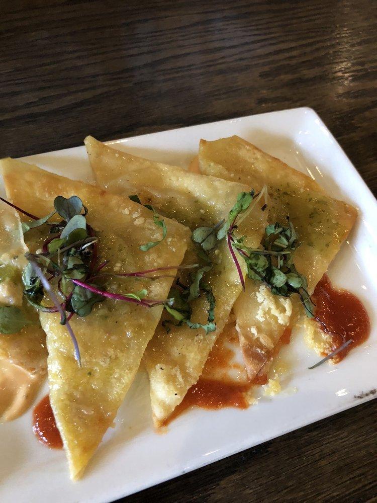 Lobster Potstickers · A blend of butter-poached lobster and salsa verde filled wontons. Steamed and seared to perfection and topped with Sriracha aioli.