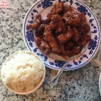 Sesame Chicken · Served with steamed rice. Spicy.